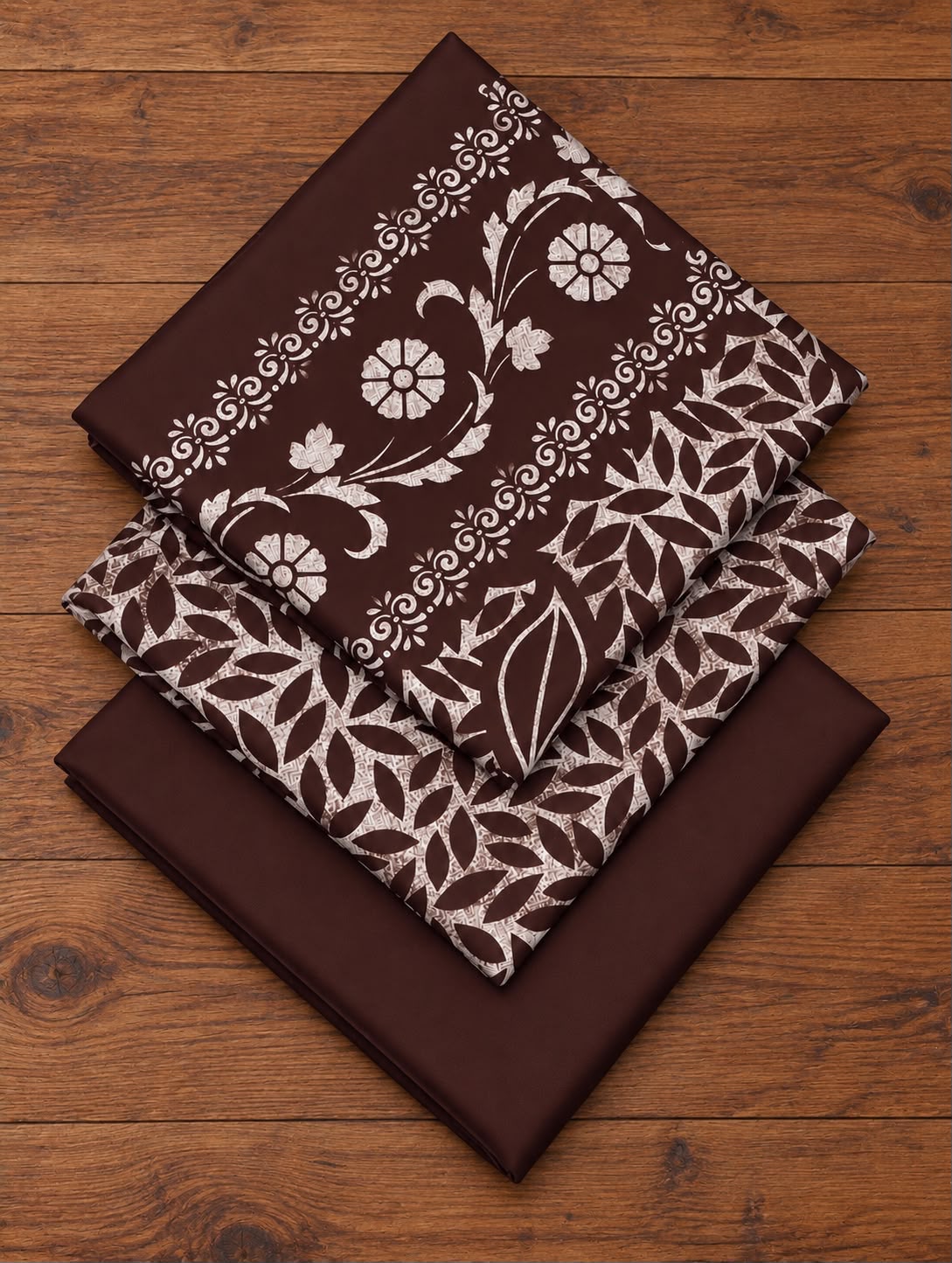 Folded brown Dhanak block-print shirt, printed dupatta and plain trouser fabric